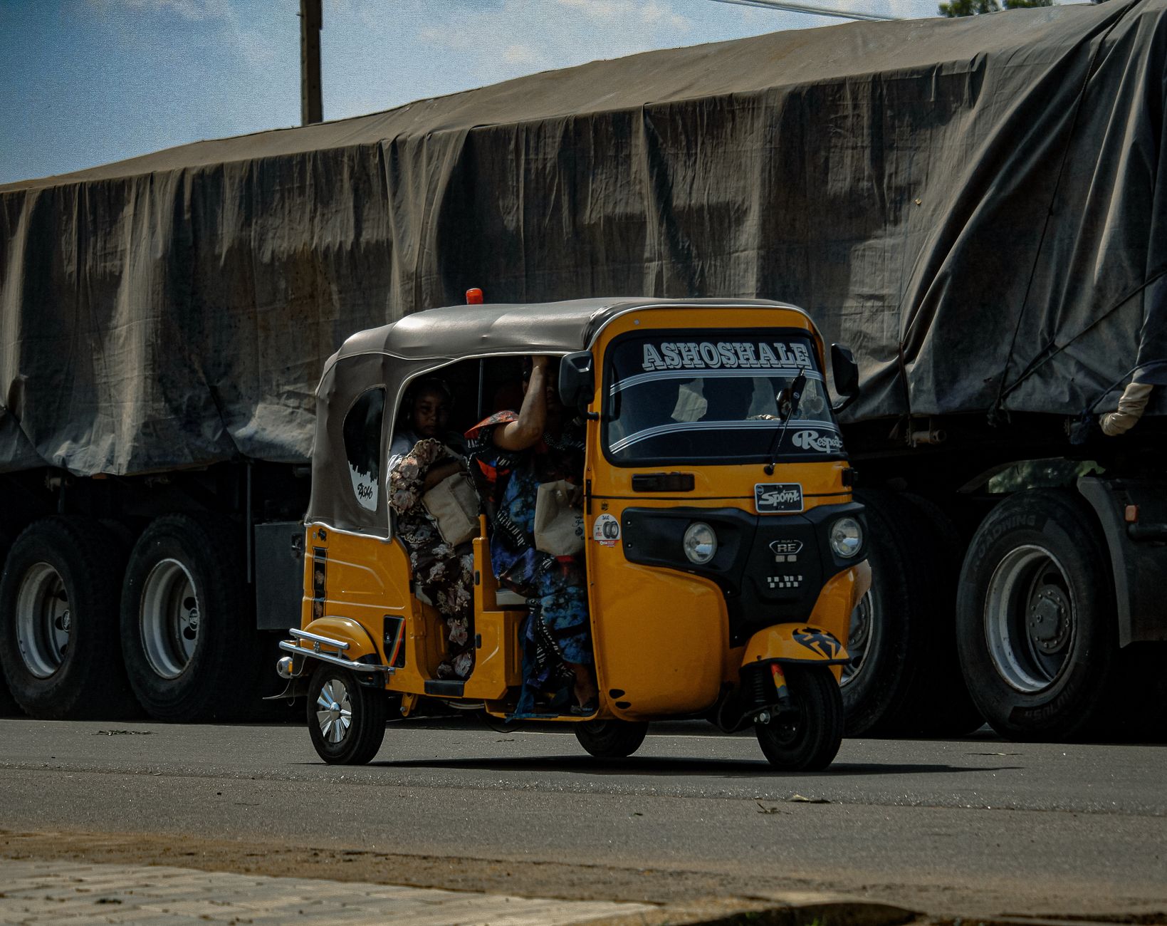 Bolt ride-hailing driver waiting outside a Lekki hotel entrance