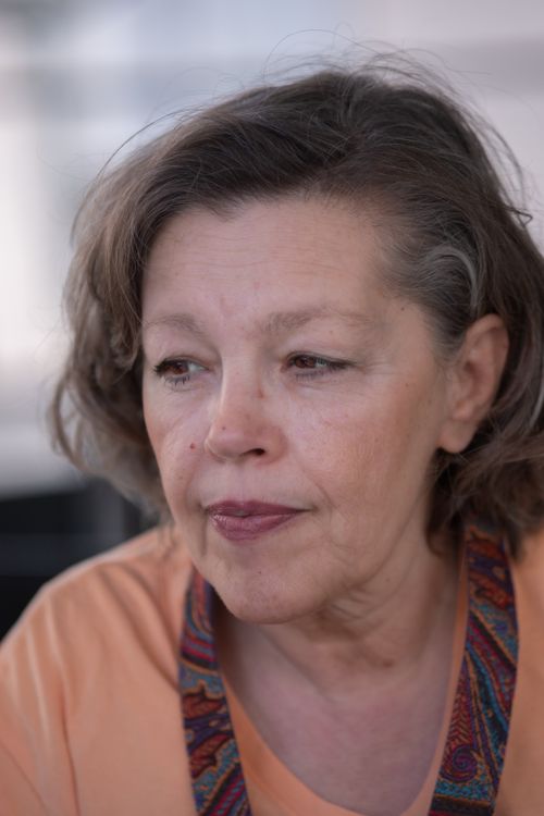 Free Portrait of a senior woman with a contemplative expression at a café in İzmir, Türkiye. Stock Photo