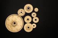 Photo of Golden Cogwheel on Black Background