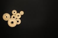 Photo of Golden Cogwheel on Black Background