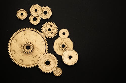 Photo of Golden Cogwheel on Black Background