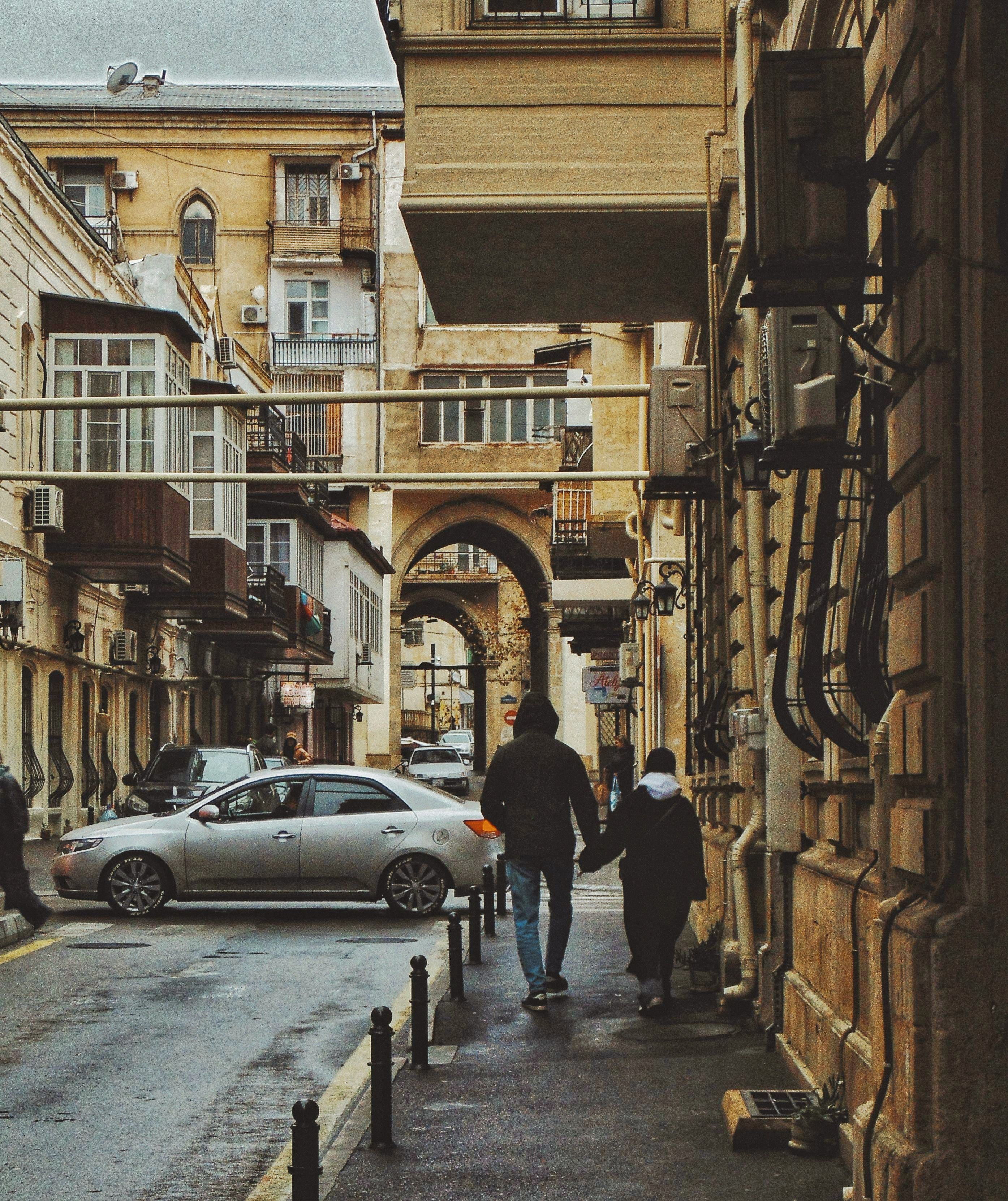 Historic Urban Scene with Arched Buildings · Free Stock Photo