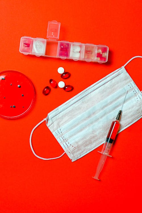 Syringe and Pills with Petri Dish