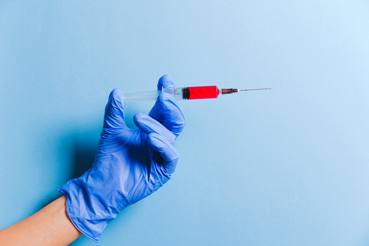 Lab technician handling blood samples for cancer-related testing