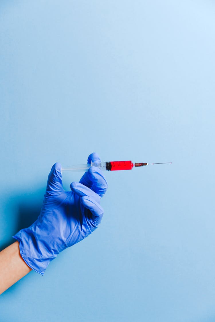 Nurse Holding Syringe