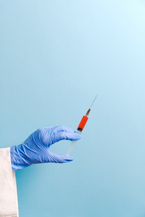 Doctor Holding Syringe