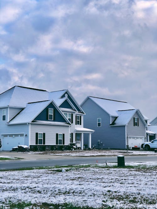 White and Gray House Under White Clouds