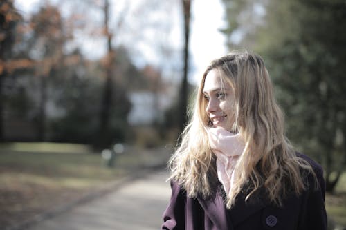 Woman in Violet Coat Smiling