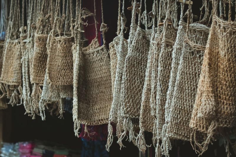 Handcrafted jute bags hanging on display