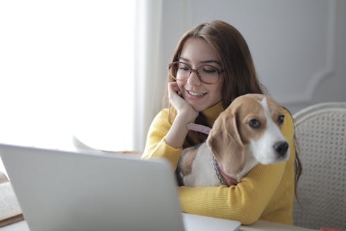 Free Woman Embracing Her Dog Stock Photo