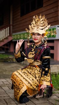 Woman in traditional Indonesian attire with intricate gold details photographed in Jakarta. - Fotografer Sidoarjo