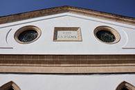 Detailed view of a historic building facade in El Puerto de Santa María, Spain.