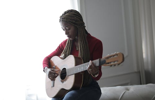 Photo Of Woman Playing Acoustic Guitar