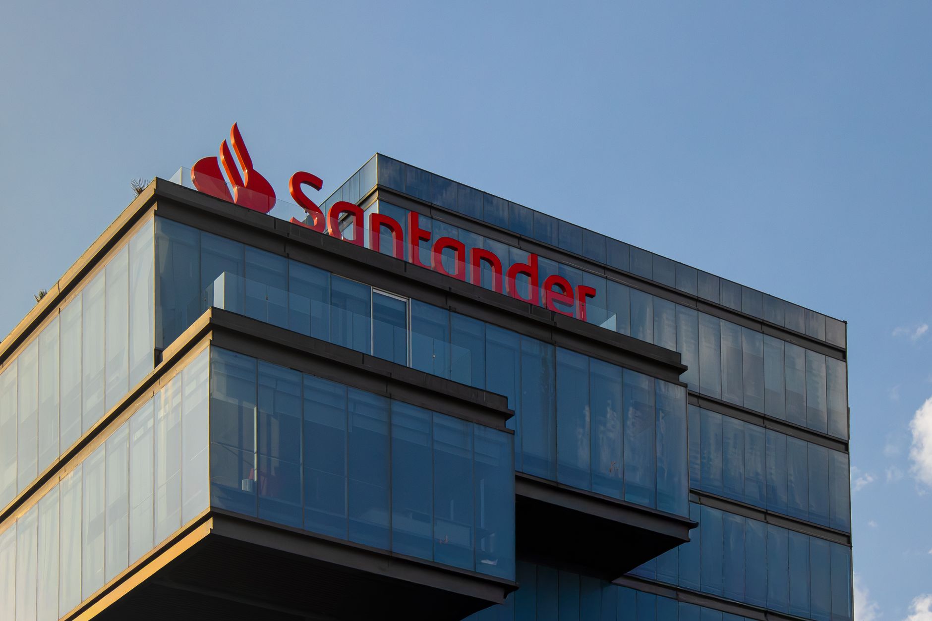 Exterior view of the modern Santander building in Puebla, Mexico, under a clear blue sky.