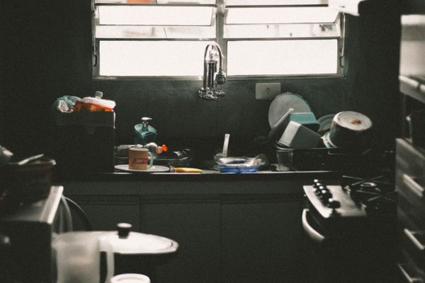 Kitchen before clean — messy with dirty dishes