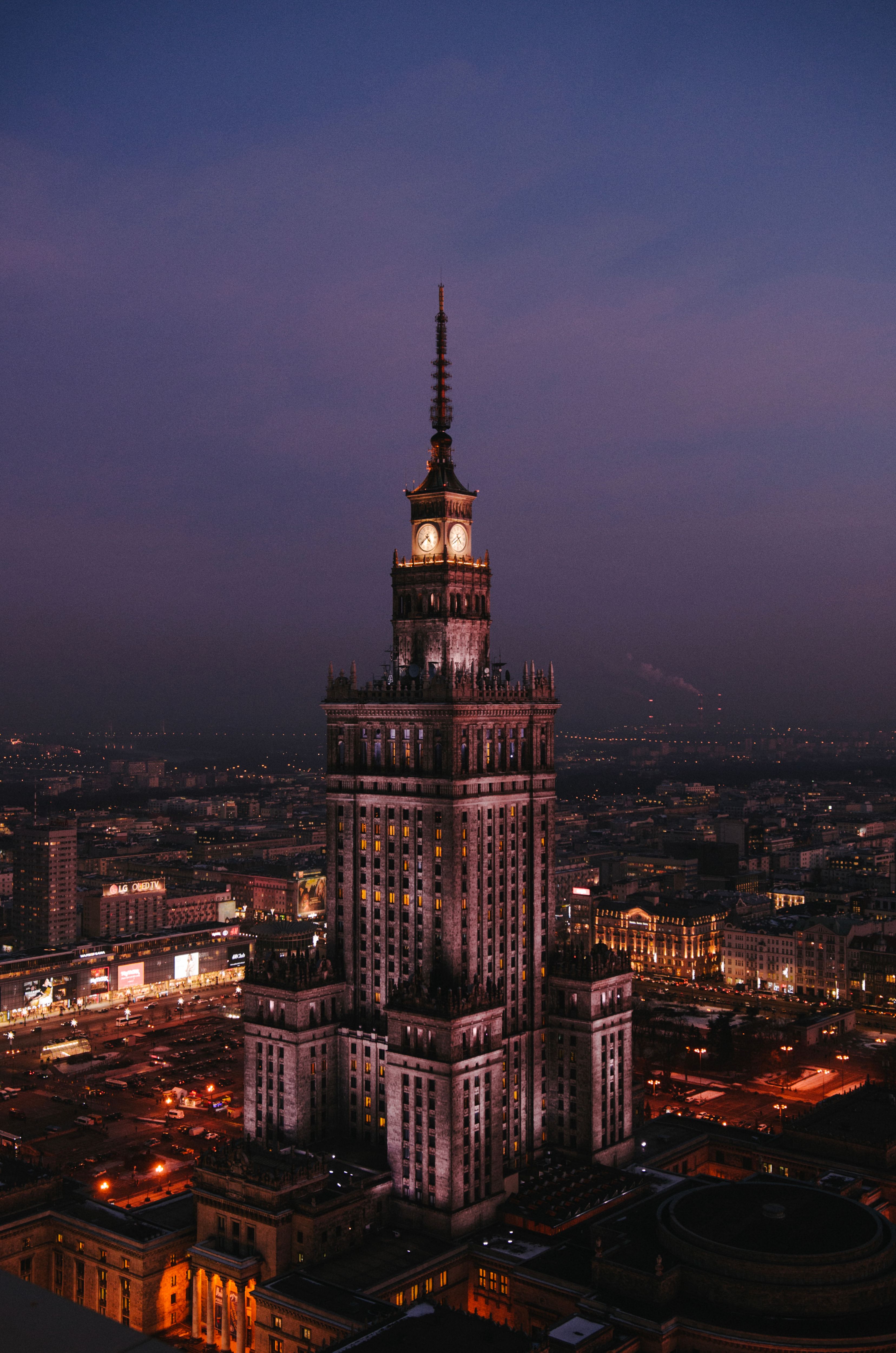 Stunning aerial shot of the Palace of Culture and Science in Warsaw at twilight.