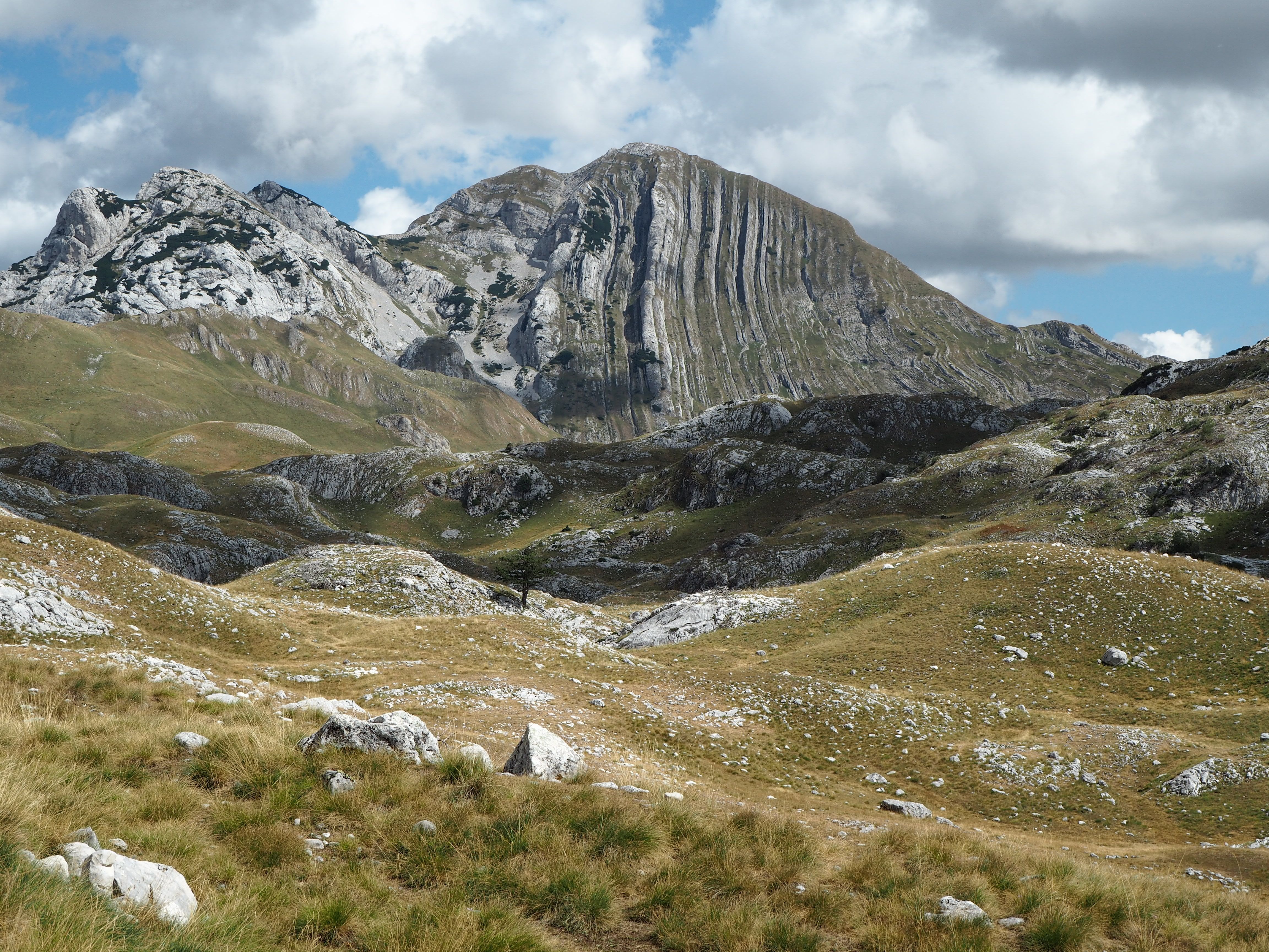 Hikers enjoying the stunning mountain scenery in Durmitor National Park, Montenegro