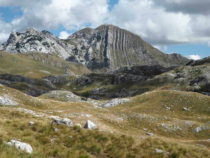 Hikers enjoying the stunning mountain scenery in Durmitor National Park, Montenegro