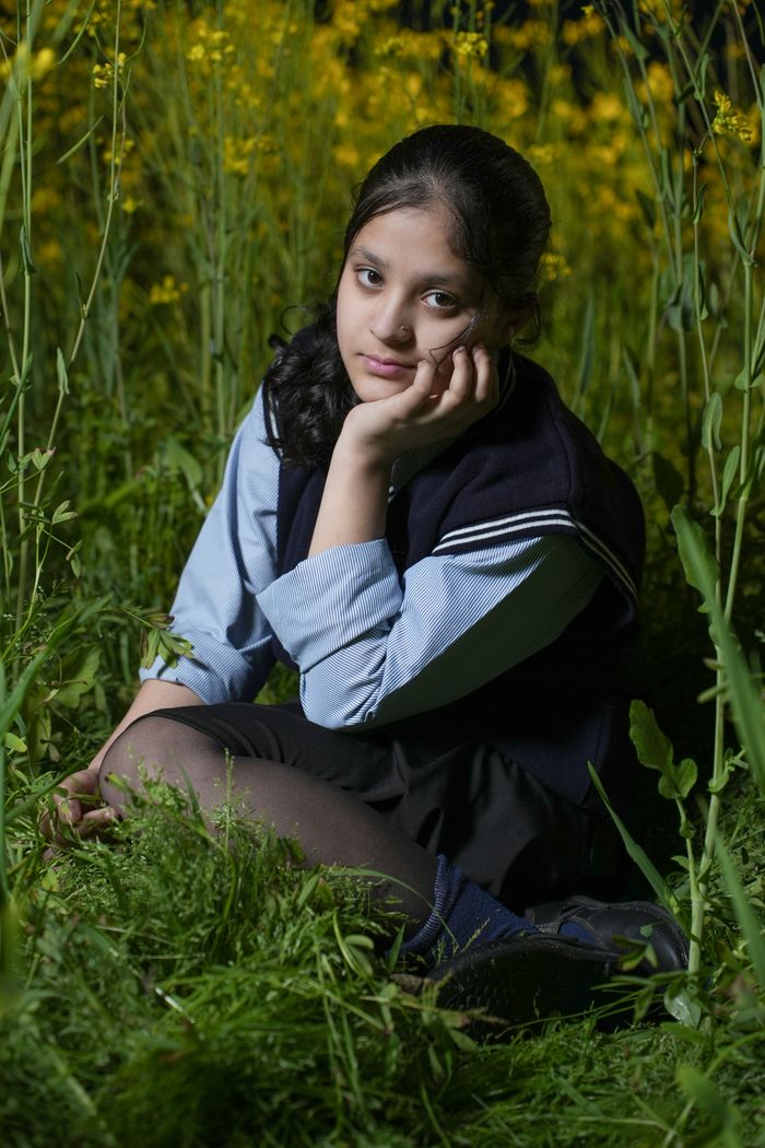 Cadet on campus grounds at dusk