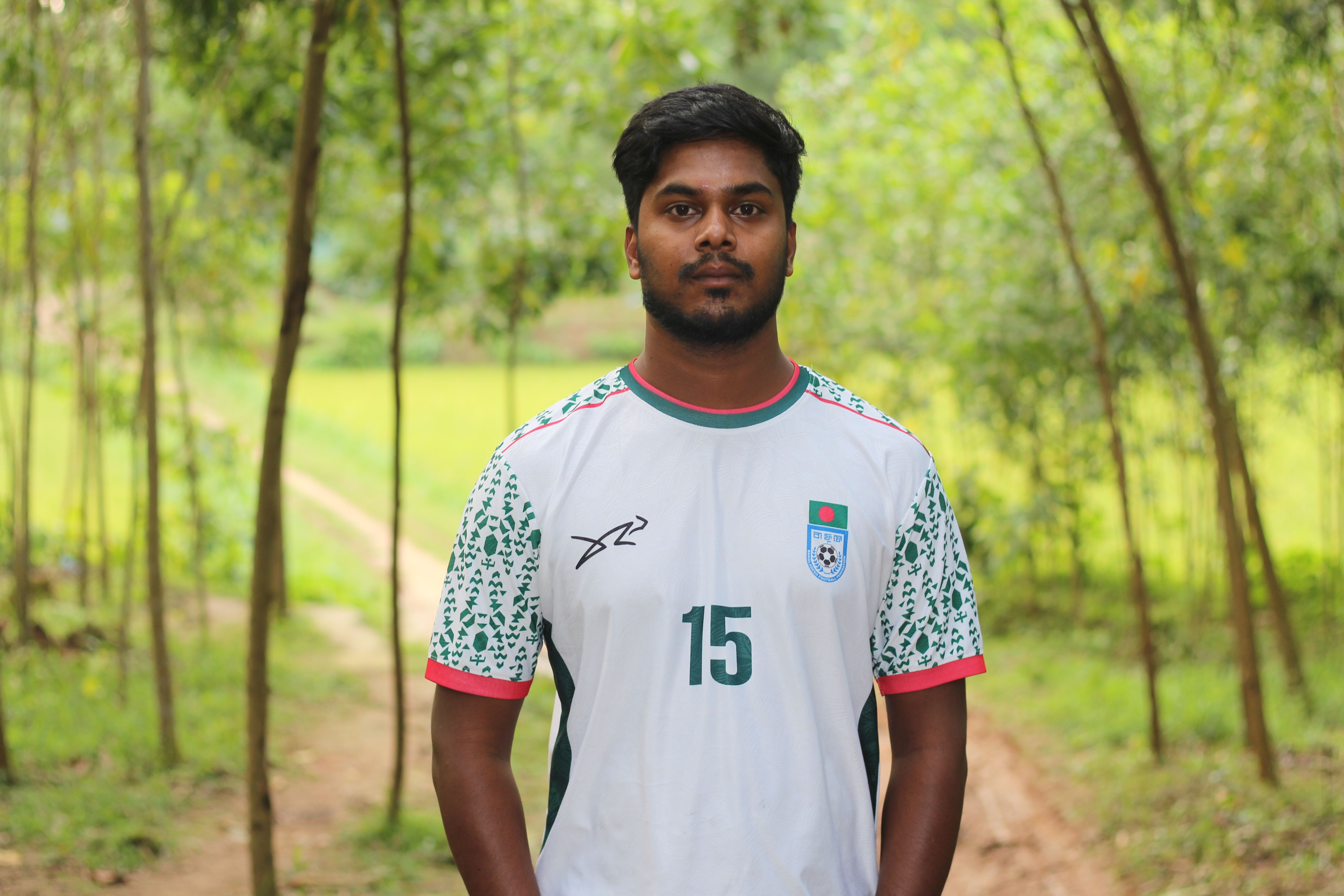 Portrait of a Young Man in a Soccer Jersey Outdoors