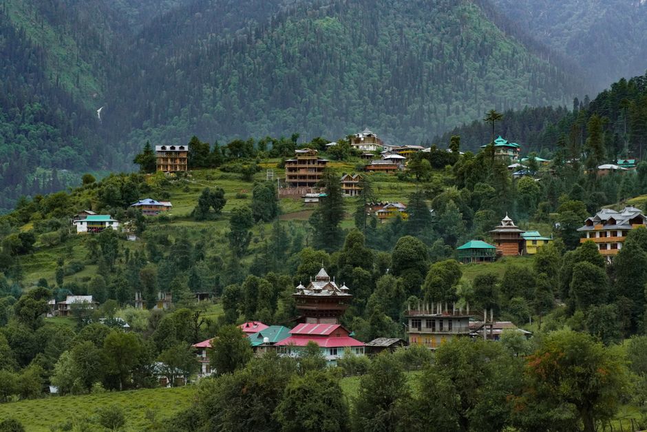 Picturesque village in Shangarh, Himachal Pradesh, nestled in lush green Himalayan landscapes.