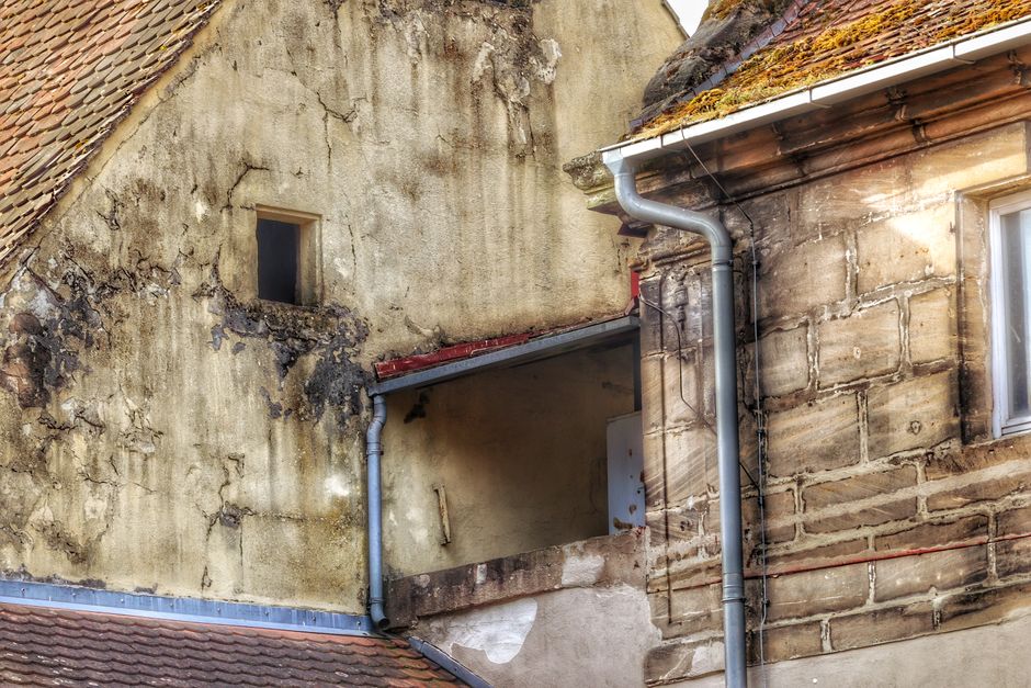 Cracked clay roof tiles on a residential roof Cracked clay roof tiles on a residential roof