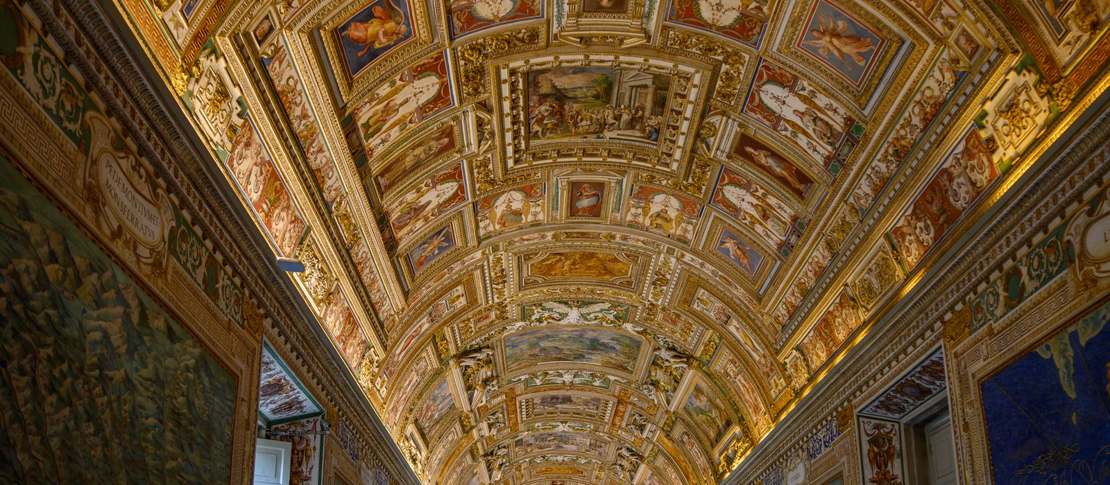 Stunning view of the ornately decorated ceiling in the Vatican Museums, a hallmark of Renaissance art.