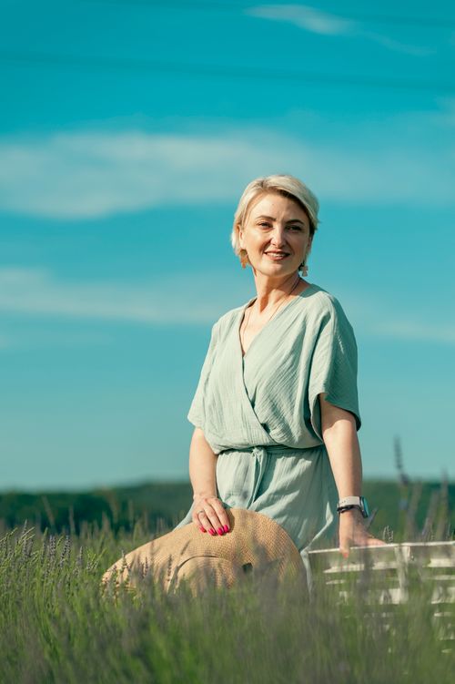 Free Smiling woman in a lavender field on a sunny day in Ukraine. Stock Photo