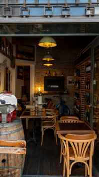 Inviting cozy wine bar featuring rustic decor and wooden furnishings, perfect for a relaxing drink.