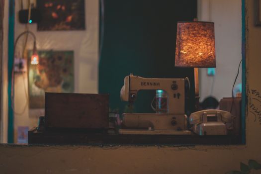 A vintage Bernina sewing machine in a cozy, warmly lit indoor environment, perfect for retro and nostalgic themes.
