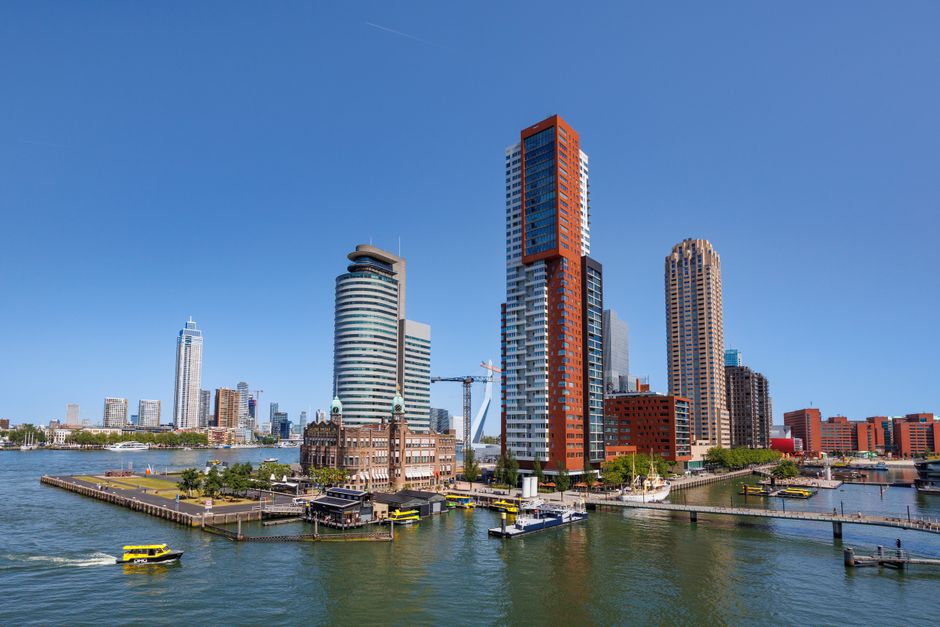 Explore the vibrant skyline of Rotterdam with modern architecture and waterfront views.
