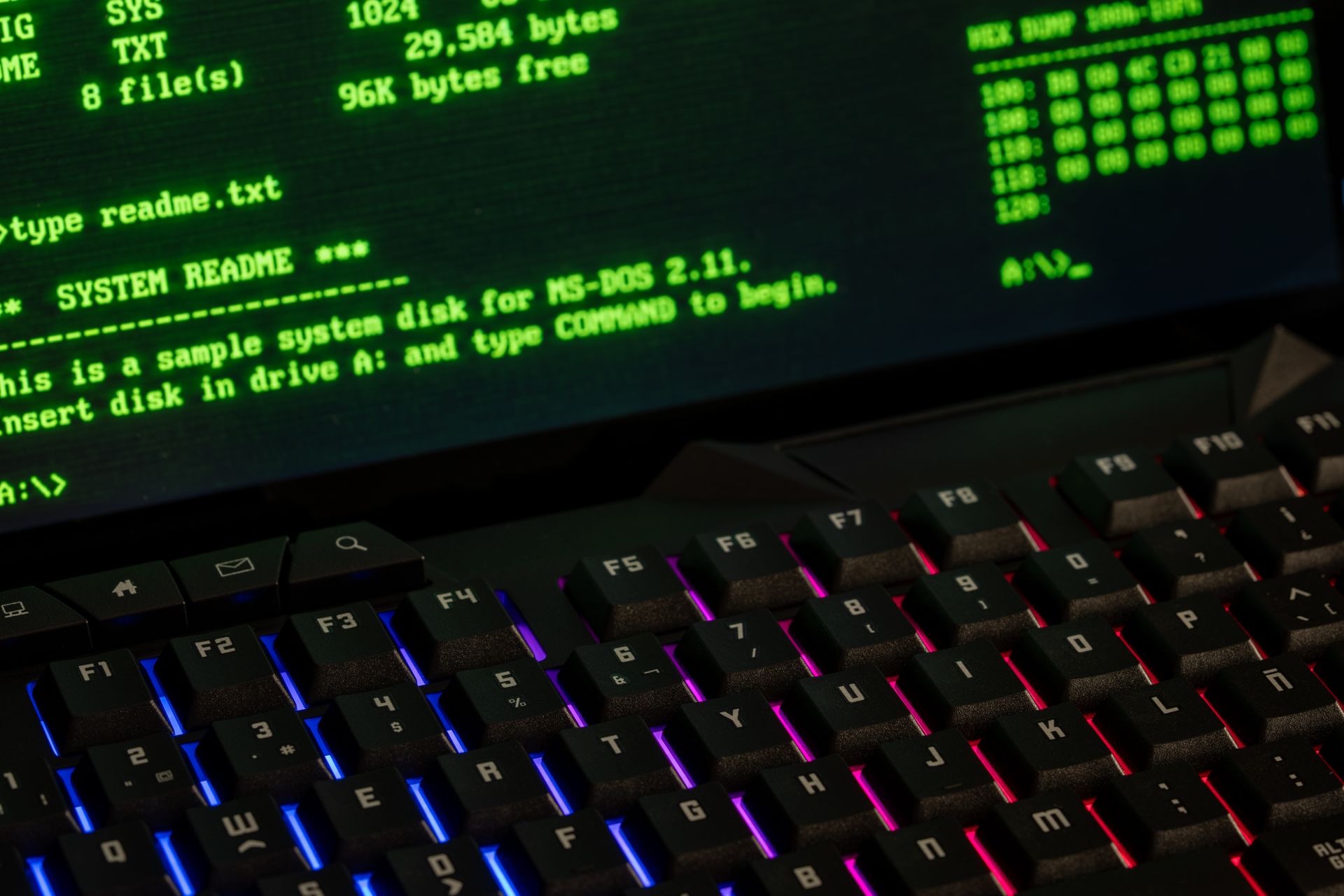 Lines of code displayed on a computer screen in a dimly lit room