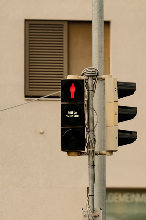 Red Pedestrian Traffic Light on Urban Street · Free Stock Photo