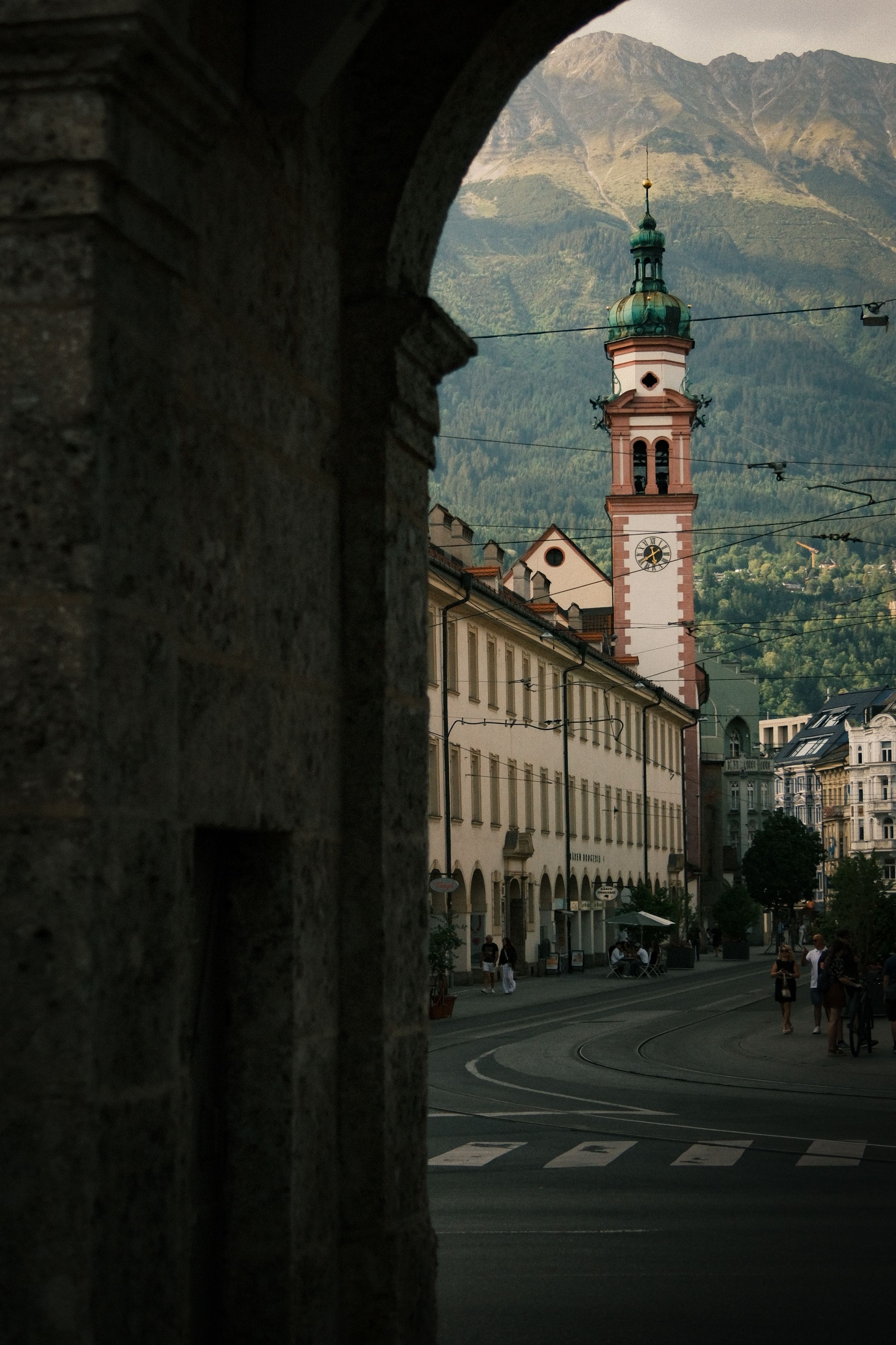 A stunning view of Innsbruck with its historic architecture and beautiful mountain scenery at twilight.