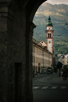 A stunning view of Innsbruck with its historic architecture and beautiful mountain scenery at twilight.