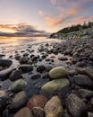 Photo of Rocky Seashore During Golden Hour