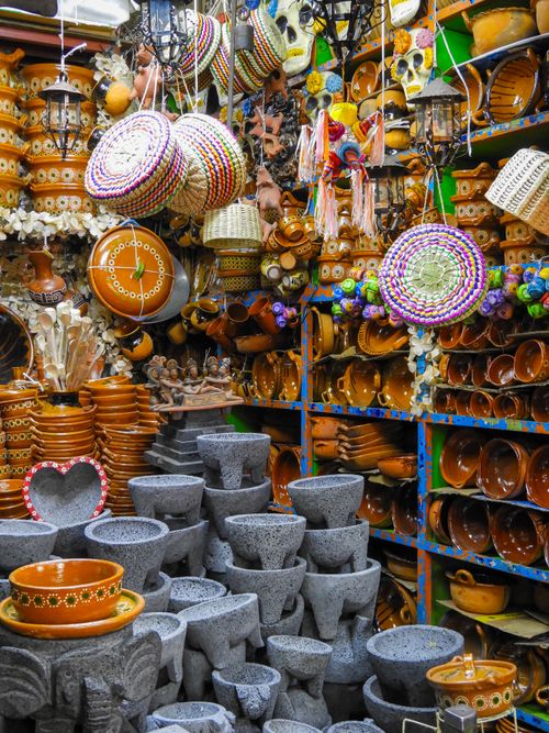 Free Explore vibrant traditional Mexican pottery and crafts at a bustling market in Mexico City. Stock Photo