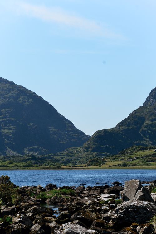 Free Beautiful landscape of a serene lake surrounded by mountains in Ireland. Stock Photo