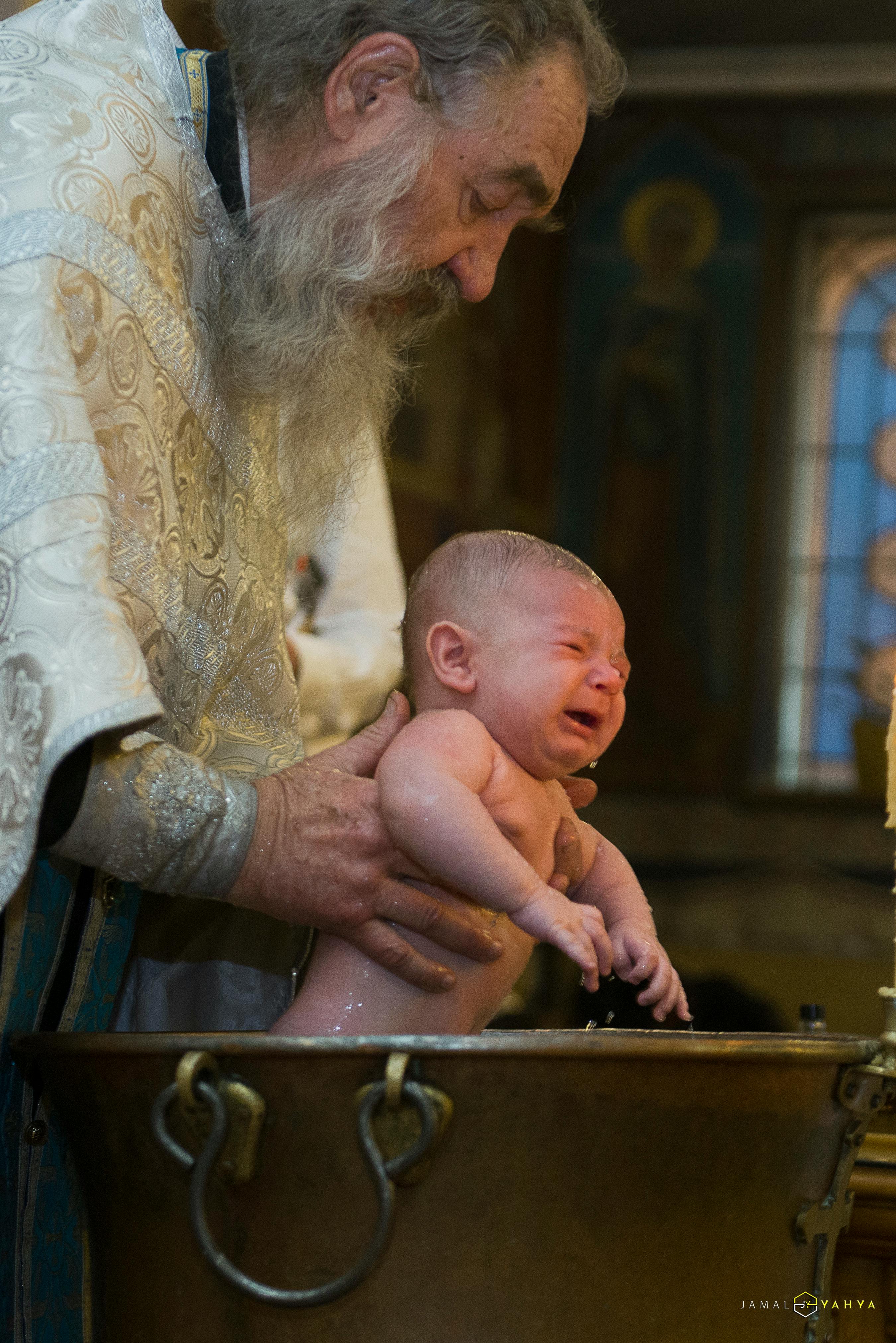 Woman Carrying Baby on Her Lap · Free Stock Photo