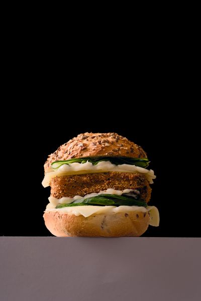 Gourmet burger on a black background, photo by Sylwester Ficek on Pexels