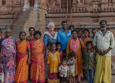 A multicultural group poses at the historic Brihadeeswarar Temple in Thanjavur, India.