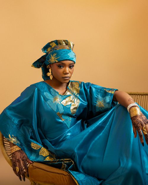 Free A fashionable Nigerian woman in vibrant traditional attire with ornate accessories. Stock Photo