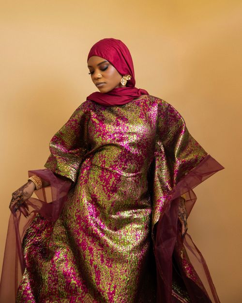 Free Portrait of a Nigerian woman in vibrant traditional attire, symbolizing cultural elegance. Stock Photo