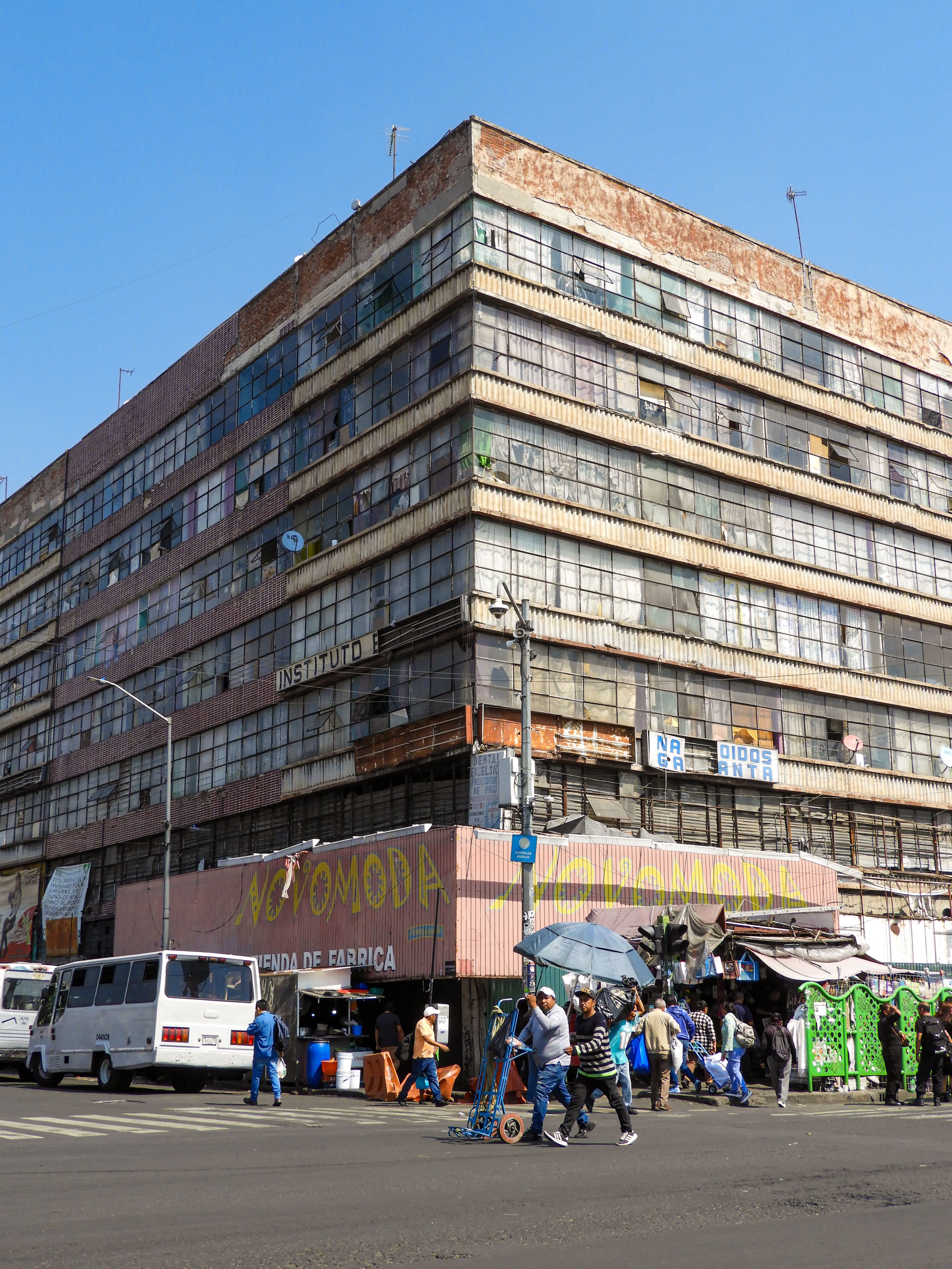 Vibrant street activity in Ciudad de México showcasing urban architecture and daily life.
