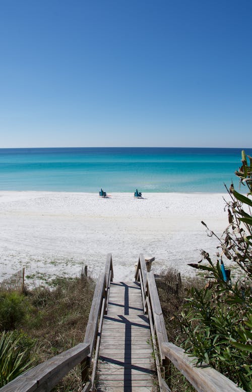 Brown Wooden Dock on White Sand Beach