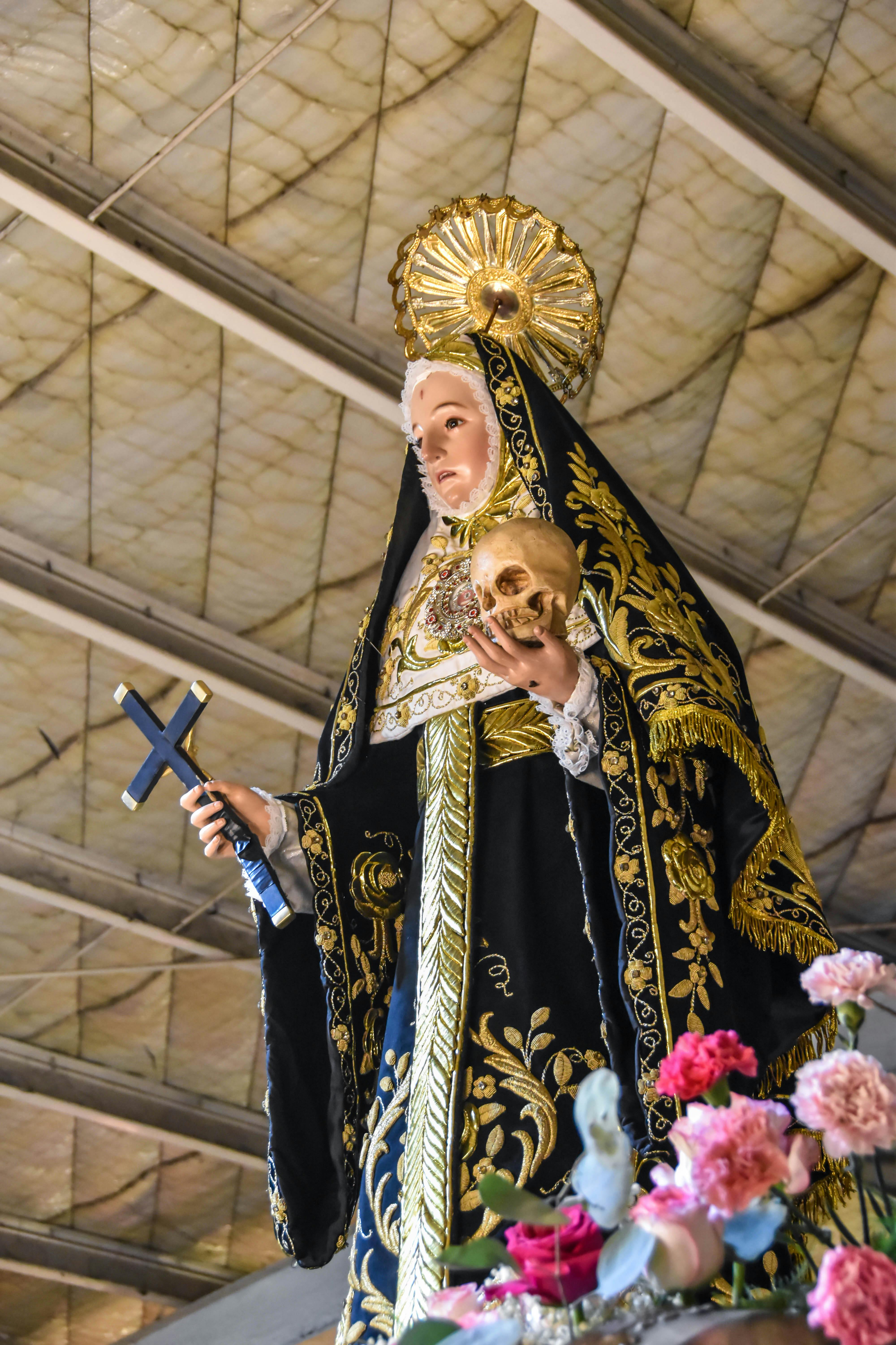 Close-up of Saint Rita statue during a religious procession in Guiguinto, Philippines.