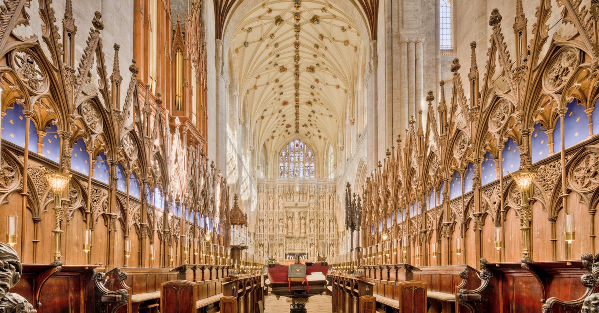 Explore the intricate Gothic architecture inside Winchester Cathedral showcasing stunning arches and carvings.