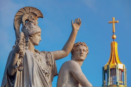 Free Close-up view of Athena and other ancient sculptures with Berlin Cathedral's dome in the background. Stock Photo