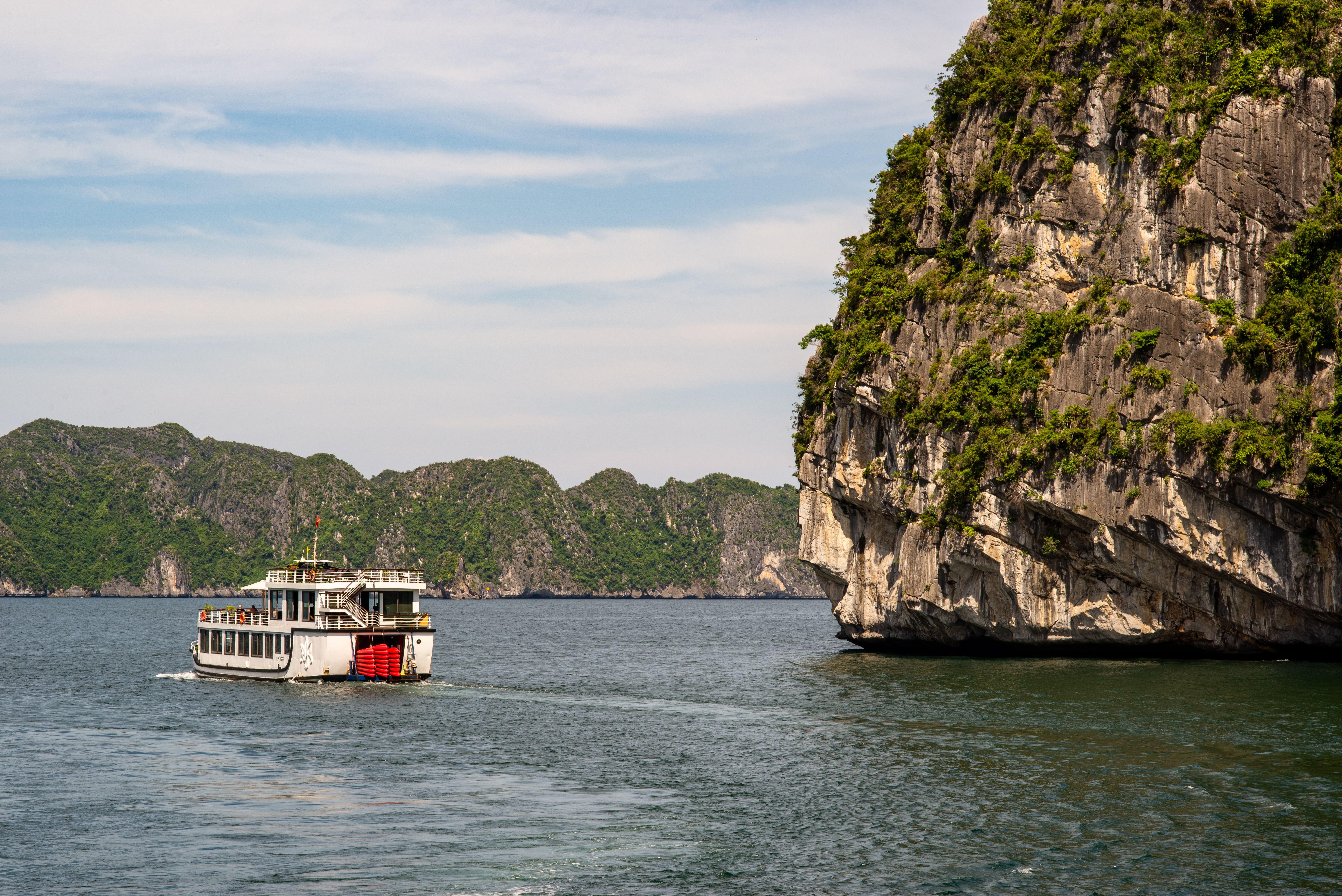 A private car traveling from Hanoi to the scenic Ha Long Bay in Vietnam