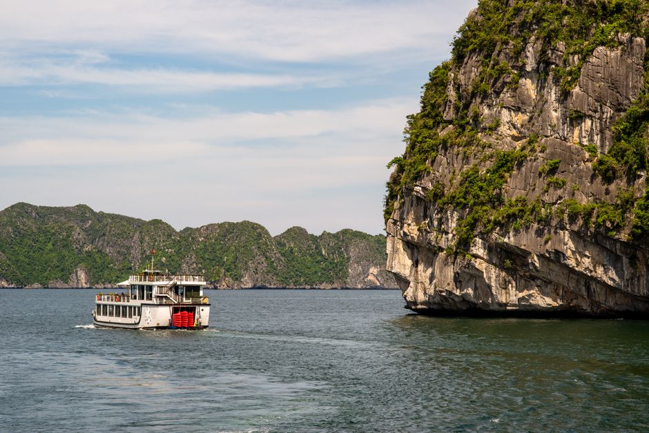 A private car traveling from Hanoi to the scenic Ha Long Bay in Vietnam